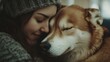 © Natchanok - Woman and Dog Cuddle Close in a Warm Embrace of Affection with Eyes Closed and Soft Light