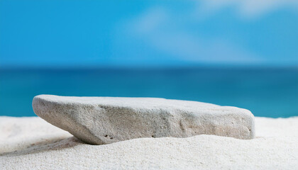 Wall Mural - Stone podium in white sand, sea view on backdrop. Empty pedestal for product presentation. Mock-up