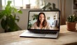 © elena_garder - Online therapy session on a laptop, friendly therapist smiling, mental health support, concept of accessible online counseling