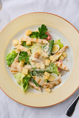 Sticker - Elegant Caesar Salad with Grilled Chicken Fillet on Textured White Background