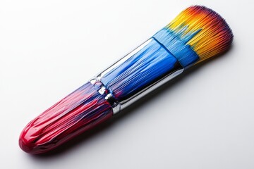 Aufkleber - Colorful paintbrush with vibrant bristles sitting on a white surface under soft lighting in a creative space