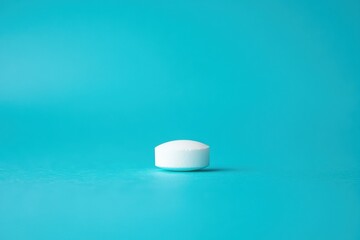 Aufkleber - White tablet resting on a vibrant teal background showcasing simplicity and purity in design