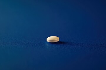 Aufkleber - White tablet resting on a blue surface with soft shadows illustrating its texture and form