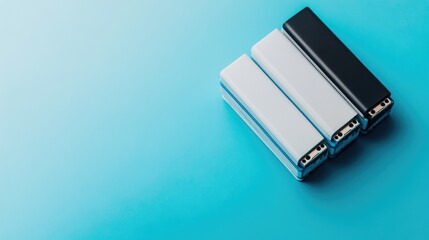 Poster - A stack of lithium-ion batteries placed on a clean white and blue background.