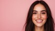 © Momphoto - A smiling woman with long dark hair poses against a soft pink background, exuding confidence and positivity.