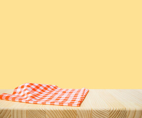 Wall Mural - Fabric cloth or placemat on wood table top on yellow pastel