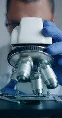 Wall Mural - scientist is meticulously examining biological sample through an advanced hightech microscope device