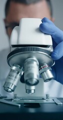 Wall Mural - scientist is meticulously examining biological sample through an advanced hightech microscope device