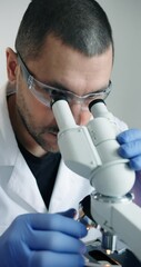 Wall Mural - dedicated researcher concentrating on detailed microscopic analysis within wellequipped laboratory e