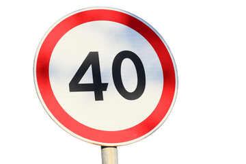 Poster - A 40 mph speed limit sign on a pole in a typical urban or rural environment.