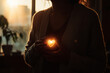 © jhx studio - Warmth and light held within the heart.