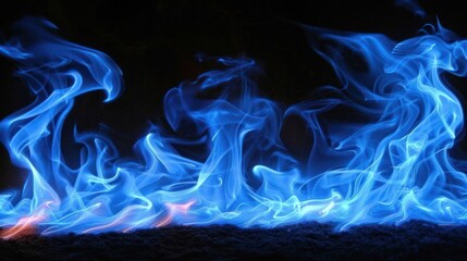 Poster - Vibrant Blue Flames Dancing Against a Dark Background, Evoking Energy and Motion