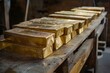 © juliars - Rows of shiny gold bars stacked neatly on a wooden shelf, representing wealth, investment, and the allure of precious metals