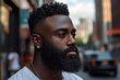 © Michael - Portrait of a fashionable young black man wearing a gold chain and diamond earring posing on a city street