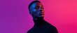 © Fernando - Portrait of a young Black man with a serious expression, illuminated by vibrant blue and pink neon lights against a colorful background Concept of fashion, style, and modern portraiture