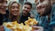 © Johannes - Closeup image of friends eating and sharing potato chips together