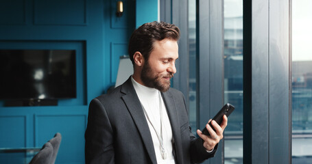 Poster - Office, businessman and reading with phone for notification, news and online article for publication. Career, male person and journalist with mobile for creative agency, digital blog or scroll review