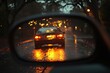 © c80 - Reflections of a car driving on a rainy street adorned with soft lights