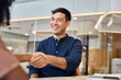 © insta_photos - Happy young Hispanic business man hr manager handshaking investor client or hiring person in office. Male executive making partnership agreement deal with partner shaking hand sitting at work meeting.