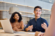 © insta_photos - Happy young executive professional manager discussing project plan with diverse business team people employees in office working together at group meeting consulting clients on financial investment.