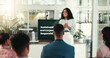 © peopleimages.com - Office, audience and screen with businesswoman for presentation, project training or discussion. Boardroom, employees and corporate trainer with technology for skills development, workshop or meeting