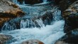 © scrdy - Frothy Waterfall Cascading Over Rocks in Mountain Stream