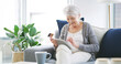 © peopleimages.com - Happy, old woman and tablet with credit card on sofa for online shopping, subscription payment or discount sale. Ecommerce, senior person and app for debit transaction and customer experience in home