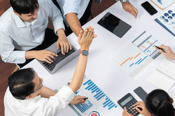 Leinwandbilder - Happy office worker and project manager celebrate in meeting room after successfully achieving business task on time and on schedule. Project management tracking software for business success. Prudent