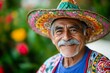 © Marko - Elderly man wearing colorful sombrero and smiling outdoors