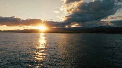 Wall Mural - Sun And Religious Celestial Clouds Over Calm Ocean For World Peace