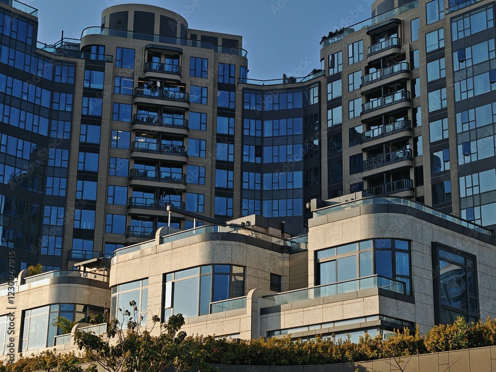 Picture of Modern Hong Kong apartment buildings; sleek, glass-fronted high-rises ...