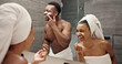 © peopleimages.com - Cream, skincare and happy with couple in bathroom for beauty, morning routine and cosmetics. Laughing, hotel resort and cleaning with man and woman at home for grooming, spa glow and self care