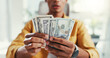 © peopleimages.com - Man, hands and counting money in office, funding investment and account for financial revenue. Male person, economic currency and professional fortune in workplace, company increase and payment