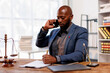 © David - Excited African American Man Lawyer talking on telephone and gesturing in office