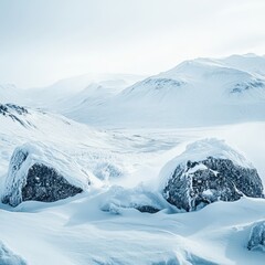 Poster - Majestic Winter Landscape with Snow-Covered Mountains and Boulders Under a Clear Sky; Discover the Serene Beauty of Pristine Nature in the Cold White Wonderland