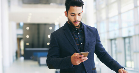 Fototapete - Reading email, phone and businessman in office with online texting, message and networking. Professional, corporate and worker on smartphone for social media, communication and contact in lobby