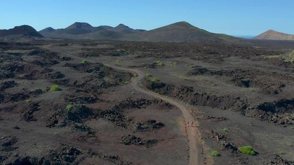 Wall Mural - Aerial drone view of mountain sea and volcanoes in Lanzarote, Canary Islands, Spain