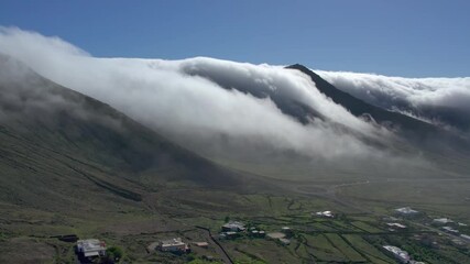 Wall Mural - Aerial drone view of mountain sea and volcanoes in Lanzarote, Canary Islands, Spain