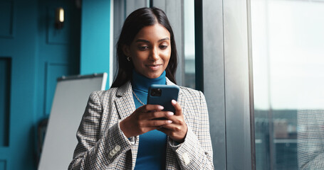 Aufkleber - Browsing, window and woman with smartphone, creative and employee with ideas for engagement and office. Happy, social media specialist and person with mobile for content creation, website or planning
