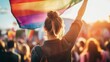 © Visioner - Woman Holding Rainbow Flag at Outdoor Pride Event