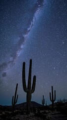 Poster - A starry sky above tall saguaro cacti in the desert, revealing the Milky Way stretching across the horizon.
