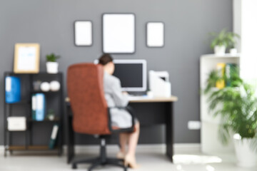 Sticker - Female office worker using modern computer at workplace in stylish office, blurred view