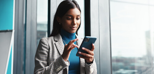 Fototapete - Office, businesswoman and text with smartphone for negotiation, funding message and investment. Career, female person and financial advisor with mobile for communication, email and typing to contact