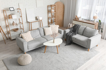 Canvas Print - Interior of modern living room with grey sofas, table and shelf units