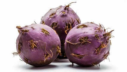 Aufkleber - Threeround taro roots with purple skin, prominently displayed in a cluster on a clean white background, highlighting their textured surface and colors.