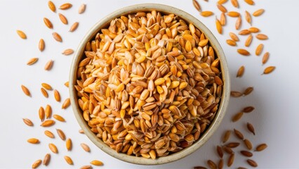 Poster - Wholegrain barnyard millet seeds in a round bowl on a white background, vibrant golden-brown seeds arranged neatly, scattered seeds around the bowl.