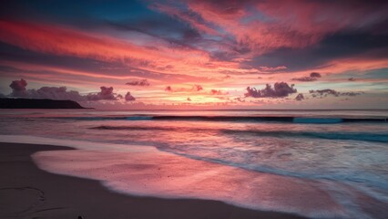 Aufkleber - Vibrant sunset with warm pink and orange hues reflecting on calm beach waters and gentle waves, foreground sandy shore creating serene atmosphere