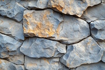 Poster - Stone wall with yellow and brown colors in a textured pattern suitable for backgrounds or architectural designs