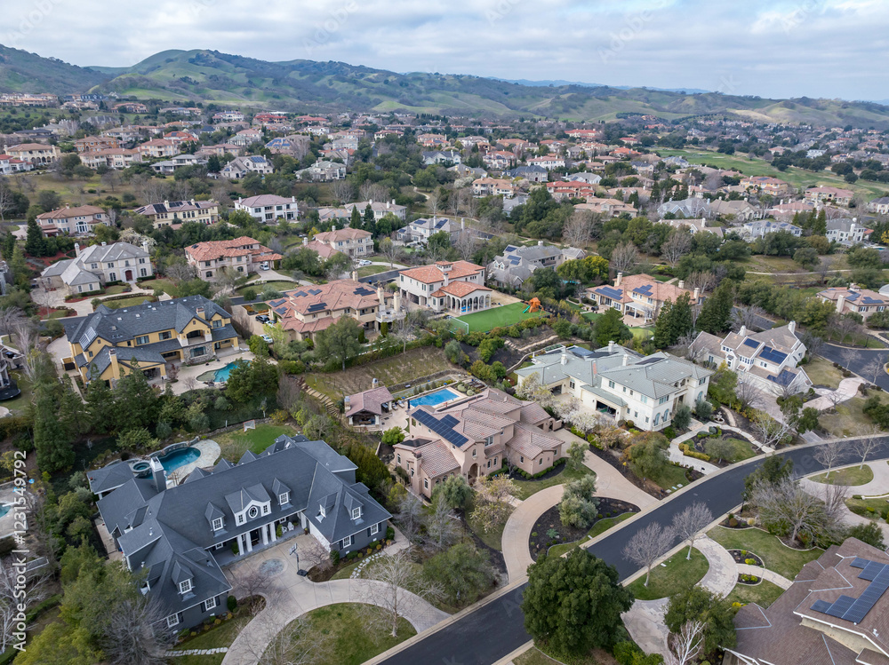 Aerial images over an affluent community in the Bay Area, with mansions ...