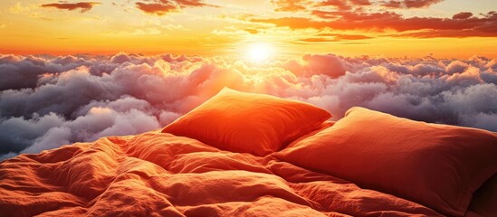 Wall Mural - Warm sunset with orange and pink hues illuminating soft clouds, featuring two orange pillows on a cozy bed, creating a tranquil and dreamy atmosphere.